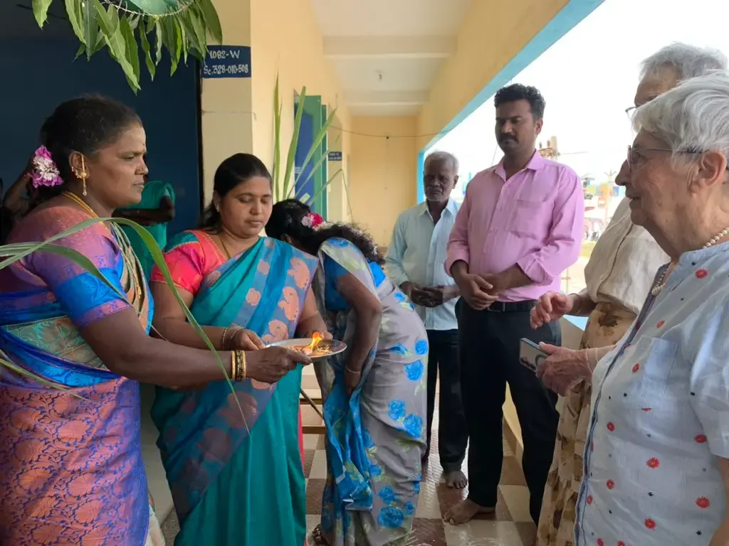 Marine Danthony with teachers in a corridor of the Saint school in Antony