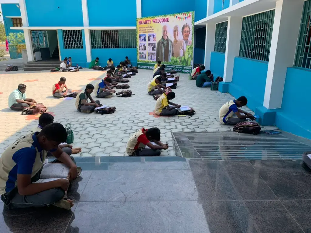 Students working in the courtyard of Saint Antony School