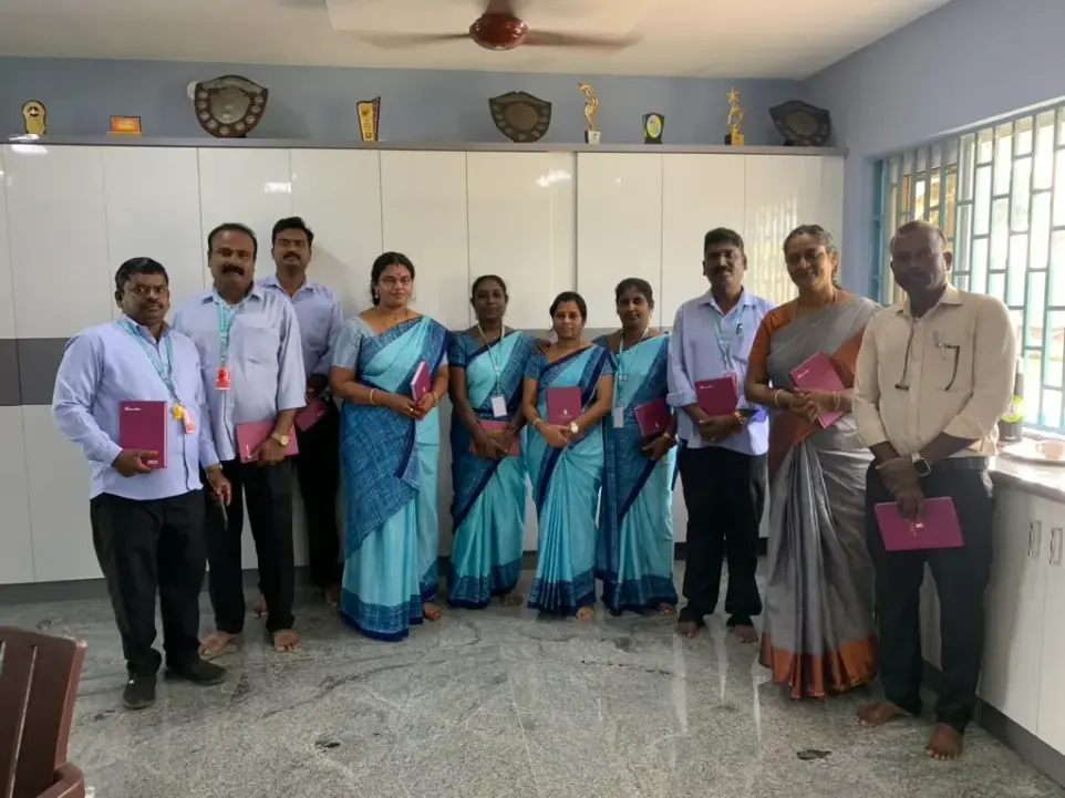 Teachers from Saint Antony school proudly holding their notebooks