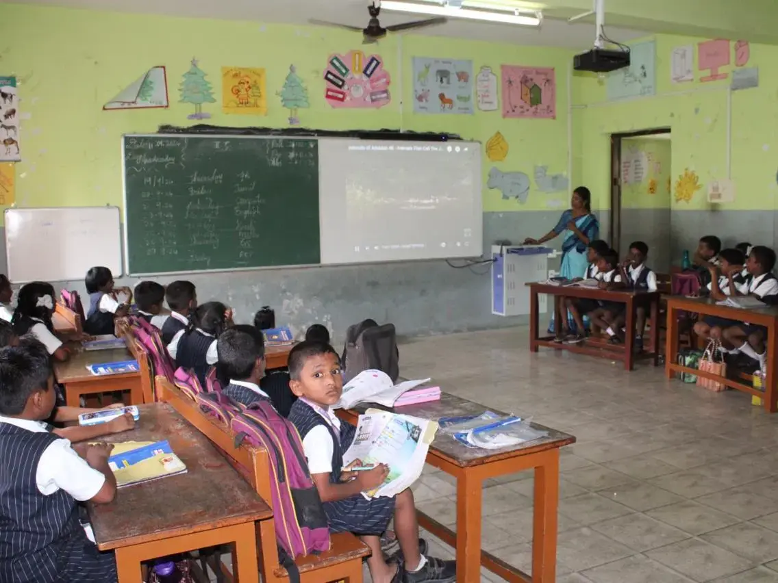 Photo of a primary school classroom with students in the middle of a lesson