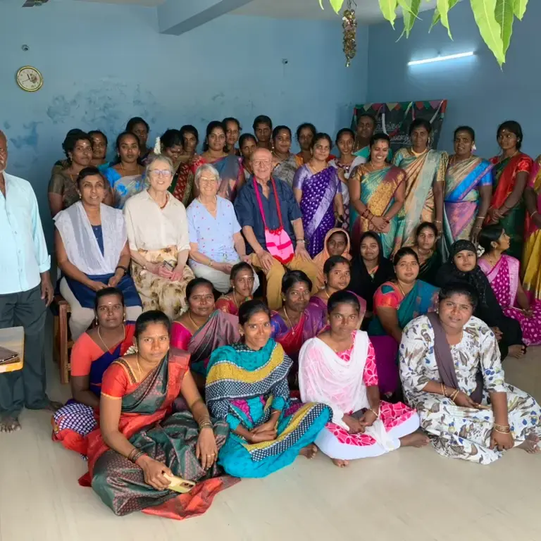 Group photo of a gathering of adults/teachers from Kanji village with the association president